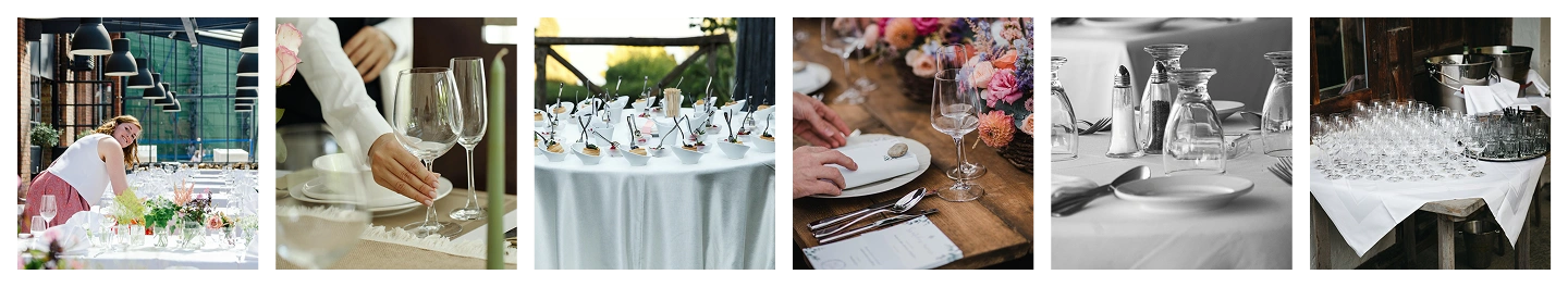 Cateringtafel ingericht met glaswerk, decoraties en opgemaakte hapjes, voorbereid voor een professioneel evenement